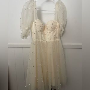 Beautiful cream pearl dress from Ava gowns. Size 00-2. Never worn. Back corset.